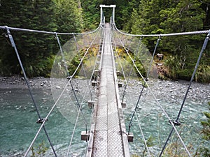 Rope bridge over mountain creek on Rees-Dart trek, New Zealand