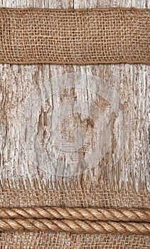 Rope and burlap textile on the old wood