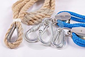 Rope, carabiner and sailing pulley. Accessories used on a deep sea yacht