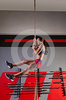 Rope Climb exercise woman workout at gym