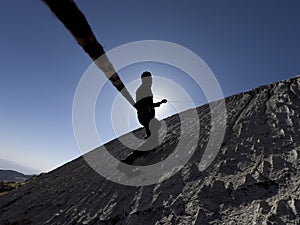 Rope climbing and sports activity on rocky ground