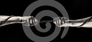 Rope, cord. Hand holding a rope, climbing rope, strength and determination concept. Safety. Macro shot isolated over