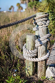 Rope fence near beach background