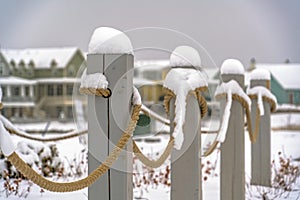 Rope fence topped with snow in Daybreak Utah