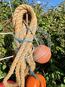 Rope and floats tied up to make garden ornament