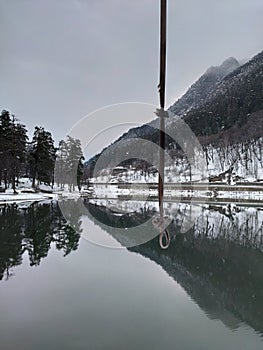 Rope for the gallows above the lake in the Caucasus mountains