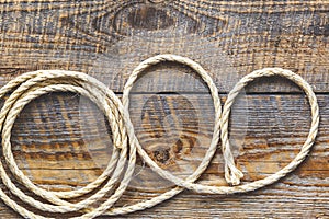 Rope gyrate on a wooden table photo