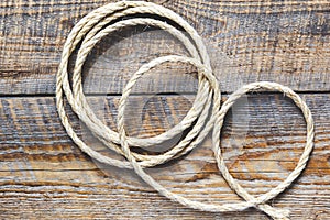 Rope gyrate on a wooden table photo