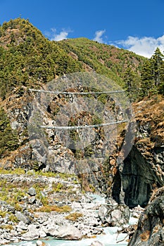 Rope hanging suspension bridges in Nepal Himalayas