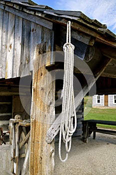 Rope hangs from an old shed beam