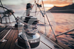 Rope hauling on the winch, on sailboat