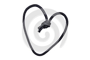 Rope isolated. Close-up of black node or knot in the shape of a heart isolated on a white background. Concept valentine, wedding