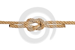 Rope isolated. Macro of figure cross node or knot from two brown ropes isolated on a white background. Navy and angler knot