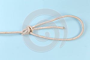 Rope knot double bowline on a blue background