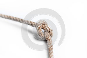 Rope with knot over white background