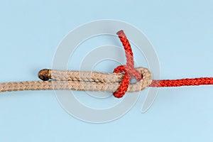 Rope knot Sheet bend on a blue background close-up