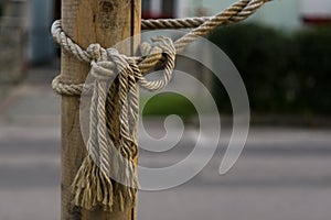 Rope knot on the wood stick. Slovakia