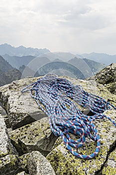 Rope is located on boulders on a mountain top