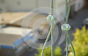 Rope lockers in of suspended wire rope platform for facade works on high multistorey buildings. Rope lockers blocks kink