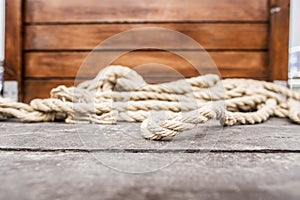 Rope lying on the wooden deck.