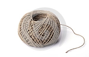 Rope made of environmentally friendly material rolled into a ball with the end isolated on a white background