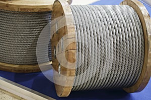 Rope metal steel on a wooden coil. Industrial wire cable