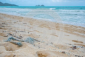 Rope and microplastic pollution littering Waimanalo Beach