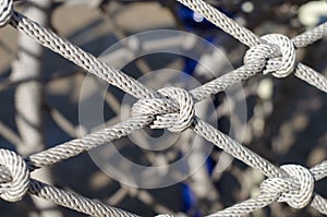 Rope. Mountaineering equipment. A knot on a rope. Grid. Braided rope.