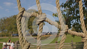 Rope net on the playground. The knots fasten the steps