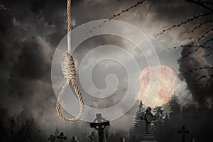 Rope noose with knot and misty cemetery on full moon night
