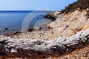 A rope over the sea in Argentario Promontory (Mar Morto Beach), Tuscany, Italy