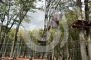 Rope park for children. Fragment of an extreme rope attraction