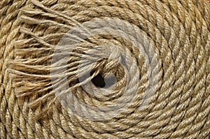 Rope rolled up on a black background