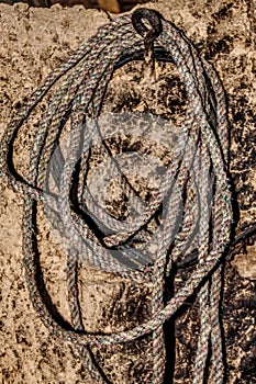 A rope rug hanging in a traditional old house