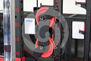 A Rope sling and roller red on exercise machine. Close-up