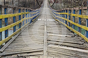 Rope suspension wooden bridge.