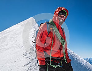 Rope team happy smiling man in climbing harness dressed red mountaineering clothes Last steps before Mont Blanc Monte Bianco