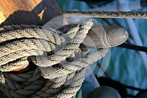 Rope tied around wooden cleat