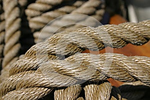 Rope tied around wooden cleat (extreme closeup)