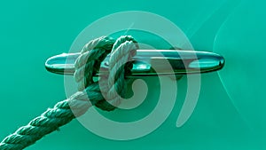 Rope Tied in Loop Around Cleat on a Boat in Green