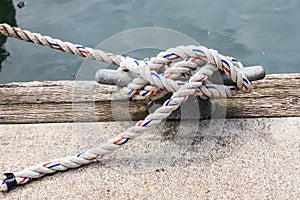 Rope tied to a cleat in an Oregon harbor