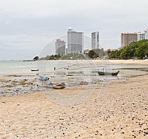 Rope tied to a fishing boat on the beach.