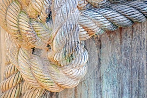 A rope tied to a knot on the pier