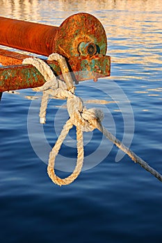 Rope tied to rusty old boat