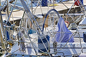 Rope winches, ropes and accessories and chromes in well equipped sailboat in white fiberglass