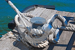 Rope wound on a double bollard on the pier