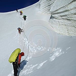 Roped team descending the icefall. photo