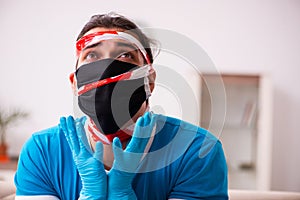 Roped young man being unhappy at home in quarantine concept