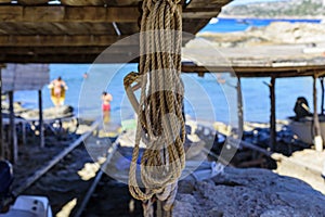 Ropes in the boarding area and workshop at the pier