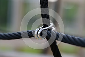 Ropes bound together with metal attachments on a playground